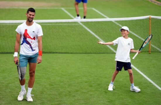 Novak Djokovic with his son Stefan, on day ten of the 2024 Wimbledon Championships at the All England Lawn Tennis and Croquet Club, London. Picture date: Wednesday July 10, 2024.