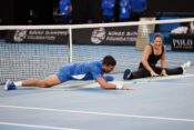 January 11, 2024: Novak Djokovic attempts a middle stretch with gymnast Georgia Godwin on Rod Laver Arena in a charity event for the Australian Tennis Foundation ahead of the Australian Open which starts on 14 January. Sydney Low/Cal Sport Media