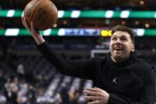 DALLAS, TX -DECEMBER 25 : Luka Doncic #77 of the Dallas Mavericks warms up before the game against the Minnesota Timberwolves at American Airlines Center on December 25, 2024 in Dallas, Texas.,Image: 950296352, License: Rights-managed, Restrictions: , Model Release: no