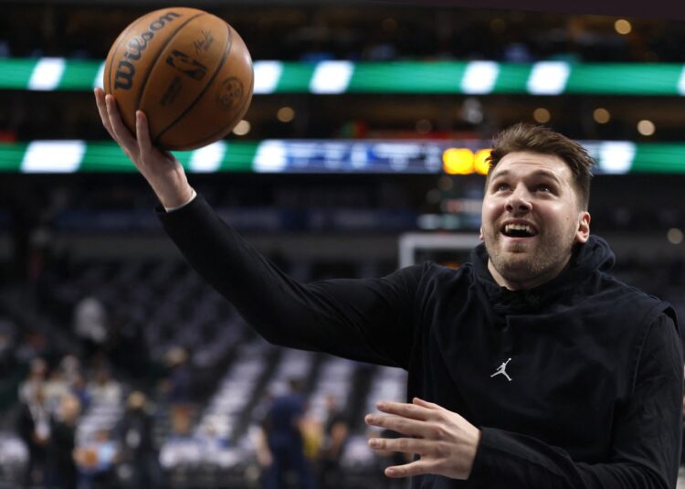 DALLAS, TX -DECEMBER 25 : Luka Doncic #77 of the Dallas Mavericks warms up before the game against the Minnesota Timberwolves at American Airlines Center on December 25, 2024 in Dallas, Texas.,Image: 950296352, License: Rights-managed, Restrictions: , Model Release: no