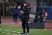 Ervin Bulku Assistant coach of Albania makes note on an electronic tablet at the half time interval of the FIFA World Cu