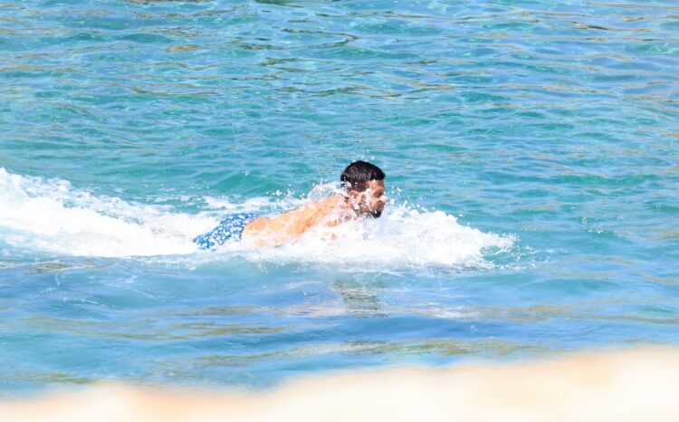 *EXCLUSIVE* Serbian tennis player Novak Djokovic and his Wife Jelena Pack on the PDA during a Family Beach Day at Nammos Beach in Mykonos.