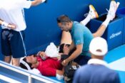 MASON, OHIO - AUGUST 11: Arthur Rinderknech of France receives medical attention against Felix Auger-Aliassime of Canada during Day 5 the Cincinnati Open at the Lindner Family Tennis Center on August 11, 2025 in Mason, Ohio. (Photo by Mauricio Paiz)
