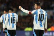 Argentina's forward Lionel Messi (R) celebrates after scoring the team’s third goal during the South American qualification football match between Argentina and Venezuela for the FIFA World Cup 2026 at the Monumental stadium in Buenos Aires on September 4